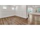 Spacious room with wood floors and paneled walls with windows overlooking the outdoors at 1409 Bluffs Ridge Way, Canton, GA 30114
