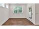 Bright, airy room with wood floors and a window with views of the outdoors at 1409 Bluffs Ridge Way, Canton, GA 30114
