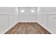 Clean, freshly painted room with wood floors and white wall trim at 1409 Bluffs Ridge Way, Canton, GA 30114