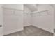 Walk-in closet with wall-mounted wire shelving for optimal organization at 1409 Bluffs Ridge Way, Canton, GA 30114