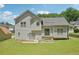 Spacious backyard view of the home featuring gray siding and bright windows at 3705 Tate Pl, Austell, GA 30106