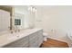 Bathroom featuring a double sink vanity, quartz countertop and wood floors at 3705 Tate Pl, Austell, GA 30106