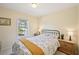 Cozy bedroom features neutral walls, bright window, and wood furnishings at 3705 Tate Pl, Austell, GA 30106
