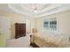 Spacious bedroom featuring a tray ceiling and a large window at 3705 Tate Pl, Austell, GA 30106