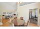 Bright dining area with a glass-top table and chairs, adjacent to the kitchen and living room at 3705 Tate Pl, Austell, GA 30106