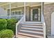 Charming entrance with steps leading to the front door, complemented by manicured landscaping, creating curb appeal at 3705 Tate Pl, Austell, GA 30106