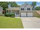 Charming two-story home with stone and siding, with a well-manicured lawn at 3705 Tate Pl, Austell, GA 30106
