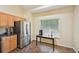 Eat-in kitchen featuring stainless steel refrigerator and table by window at 3705 Tate Pl, Austell, GA 30106