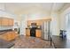 Bright kitchen with stainless steel appliances, oak cabinets, and a breakfast nook area at 3705 Tate Pl, Austell, GA 30106