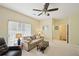 Comfortable living room with a ceiling fan and ample natural light at 3705 Tate Pl, Austell, GA 30106
