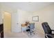 Office view from entry features a computer desk, rolling chair, and white board at 3705 Tate Pl, Austell, GA 30106
