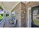 Inviting porch with stone accents, seating, and a view of the surrounding neighborhood, perfect for relaxing at 3705 Tate Pl, Austell, GA 30106