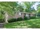 Well-maintained brick home with a green lawn and mature landscaping adding to its curb appeal at 4236 Beaver Ruin Nw Ct, Lilburn, GA 30047