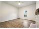 Bright bedroom features light hardwood floors, a ceiling fan, and a fireplace at 481 Glenwood Se Ave, Atlanta, GA 30312