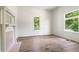Bright bedroom features light hardwood floors, a fireplace, and two large windows at 481 Glenwood Se Ave, Atlanta, GA 30312