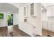 Bright kitchen with white cabinets, marble counters and backsplash, and a butler's pantry at 481 Glenwood Se Ave, Atlanta, GA 30312