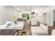 Bright living space with hardwood floors, modern furnishings, and an open layout to the kitchen and dining areas at 481 Glenwood Se Ave, Atlanta, GA 30312