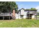 View of the backyard with a wooden deck, stairs and chimney at 5243 Valleyview Dr, Acworth, GA 30102
