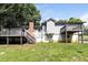 Spacious backyard featuring a brick chimney, two decks, and lush green grass at 5243 Valleyview Dr, Acworth, GA 30102