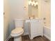 Cozy bathroom featuring a toilet, a single sink vanity with modern faucet, and a shower-tub combination at 5243 Valleyview Dr, Acworth, GA 30102