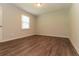 This bedroom features wood-look floors and a window with natural light at 5243 Valleyview Dr, Acworth, GA 30102