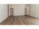 Bedroom featuring light wood floors, white trim, and open closet doors at 5243 Valleyview Dr, Acworth, GA 30102