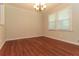 Dining room featuring hardwood floors, a chandelier, white trim, and large window at 5243 Valleyview Dr, Acworth, GA 30102