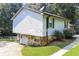Two-story home featuring stone foundation, vinyl siding, a driveway, and a well-maintained lawn at 5243 Valleyview Dr, Acworth, GA 30102