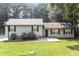 Charming single-story home with light-colored siding, black shutters, and a well-maintained lawn at 5243 Valleyview Dr, Acworth, GA 30102