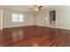 Bright living room with hardwood floors, white trim, and staircase with open door at 5243 Valleyview Dr, Acworth, GA 30102