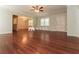Inviting living room showcases hardwood floors, light-colored walls, and an open layout leading to the dining area at 5243 Valleyview Dr, Acworth, GA 30102
