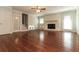 Spacious living room features hardwood floors, a brick fireplace, and abundant natural light from the large glass doors at 5243 Valleyview Dr, Acworth, GA 30102