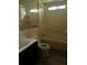 Bathroom with toilet, vanity and shower-tub combo at 710 Seals Rd, Dallas, GA 30157