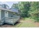 View of the backyard and back of the house, with a deck at 2650 Montego Dr, Buford, GA 30519