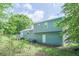 View of the backyard and back of the house, with a deck at 2650 Montego Dr, Buford, GA 30519