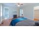 Comfortable bedroom with wood floors, ceiling fan, closet and en-suite bathroom entrance at 2650 Montego Dr, Buford, GA 30519