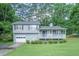 Charming two-story home with a welcoming front porch and well-maintained lawn at 2650 Montego Dr, Buford, GA 30519