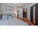 Cozy bedroom with a fireplace, hardwood floors, and neutral walls at 2650 Montego Dr, Buford, GA 30519