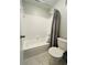 Full bathroom with tub and shower combination and tiled walls at 3432 Ivys Walk, Atlanta, GA 30340