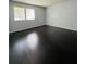 Bedroom with window and dark hardwood flooring at 3432 Ivys Walk, Atlanta, GA 30340