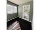 Sunlit bedroom featuring hardwood floors, large window, and neutral paint at 3432 Ivys Walk, Atlanta, GA 30340