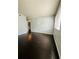 Bright bedroom with window and dark hardwood floors at 3432 Ivys Walk, Atlanta, GA 30340