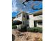 Well-kept condo exterior with tidy landscaping and a private covered deck at 3432 Ivys Walk, Atlanta, GA 30340