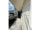 Well-maintained condo building featuring tidy landscaping, a covered deck, and welcoming walkway at 3432 Ivys Walk, Atlanta, GA 30340