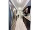 Galley kitchen featuring stainless steel appliances, granite counters, and wood cabinets for a modern look at 3432 Ivys Walk, Atlanta, GA 30340