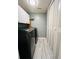 Efficient laundry room with modern washer, dryer, and storage cabinets at 3432 Ivys Walk, Atlanta, GA 30340