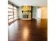 Bright living room with dark hardwood floors, a sliding barn door, and a stone fireplace at 3432 Ivys Walk, Atlanta, GA 30340