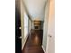 Inviting living room with beautiful hardwood floors, a barn door, and a stone fireplace at 3432 Ivys Walk, Atlanta, GA 30340