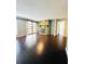 Spacious living room featuring dark hardwood floors, sliding barn door, and beautiful stone fireplace at 3432 Ivys Walk, Atlanta, GA 30340