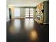 Spacious living room boasting hardwood floors, stone fireplace, and sliding barn doors for an open feel at 3432 Ivys Walk, Atlanta, GA 30340